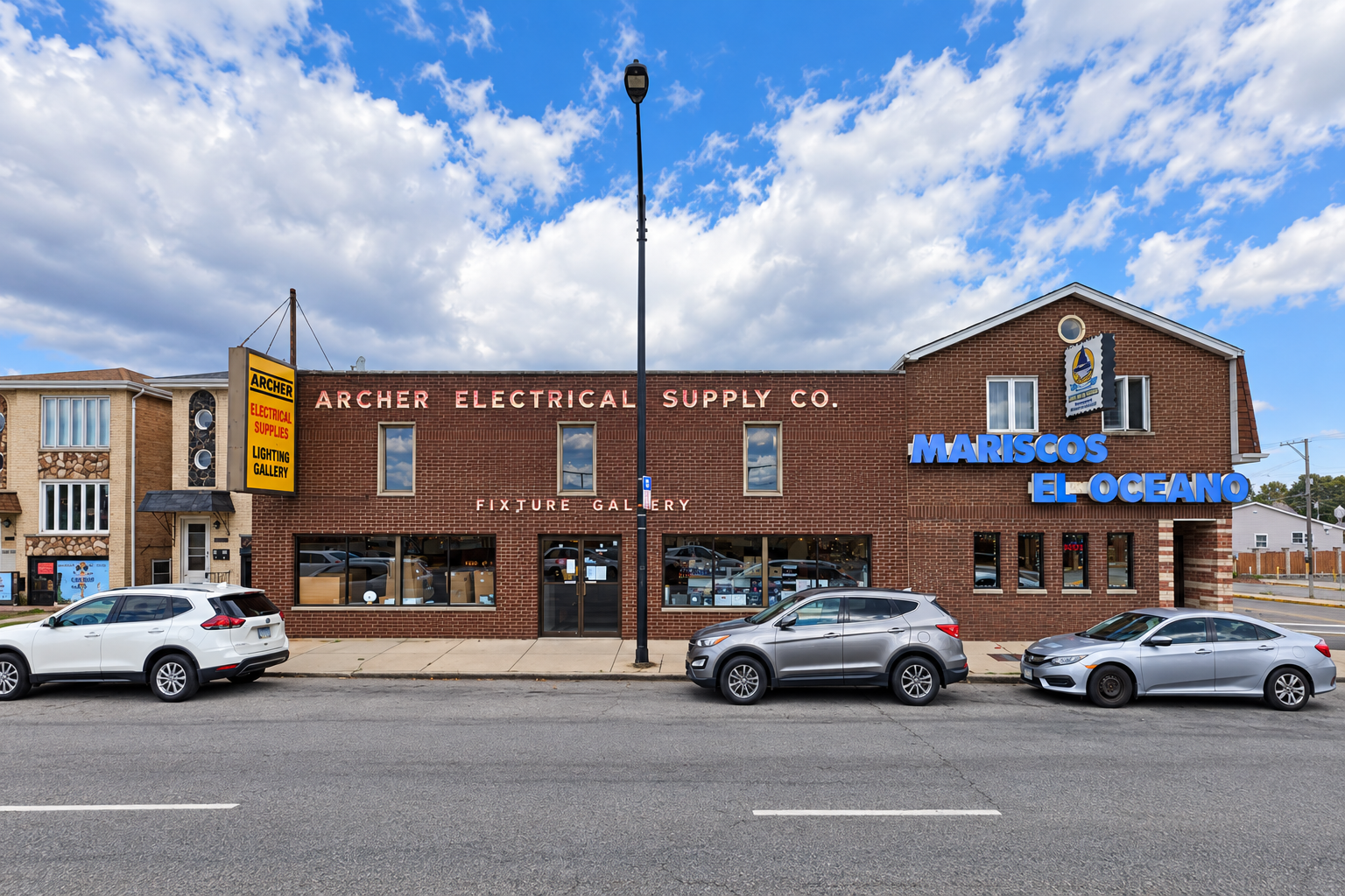 Archer Electrical Supply Co. brick storefront and yellow Archer sign in Chicago.